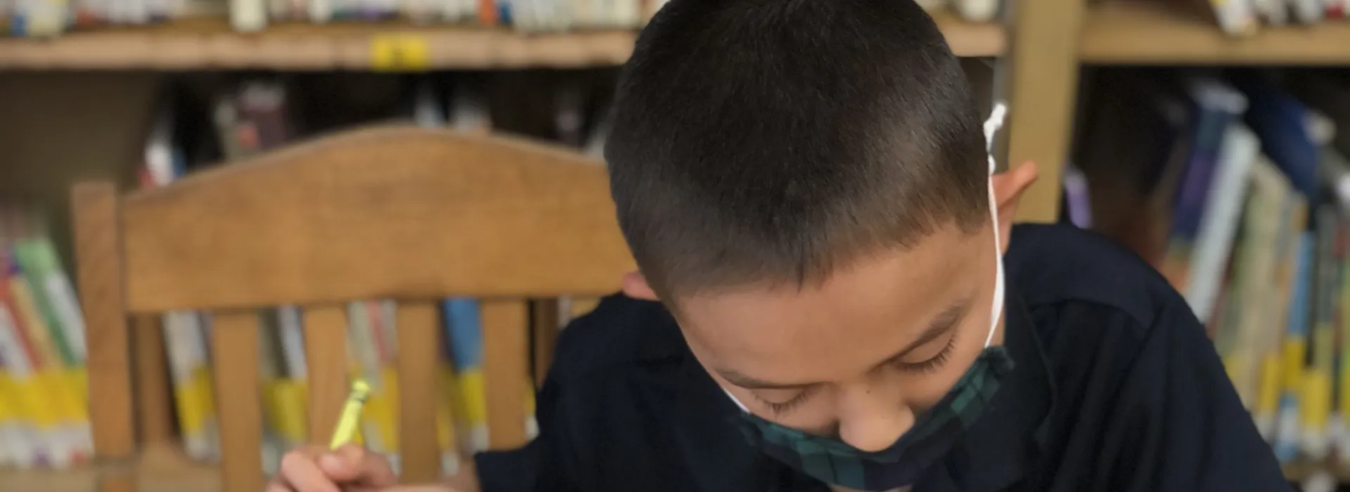 niemes student doing arts and crafts