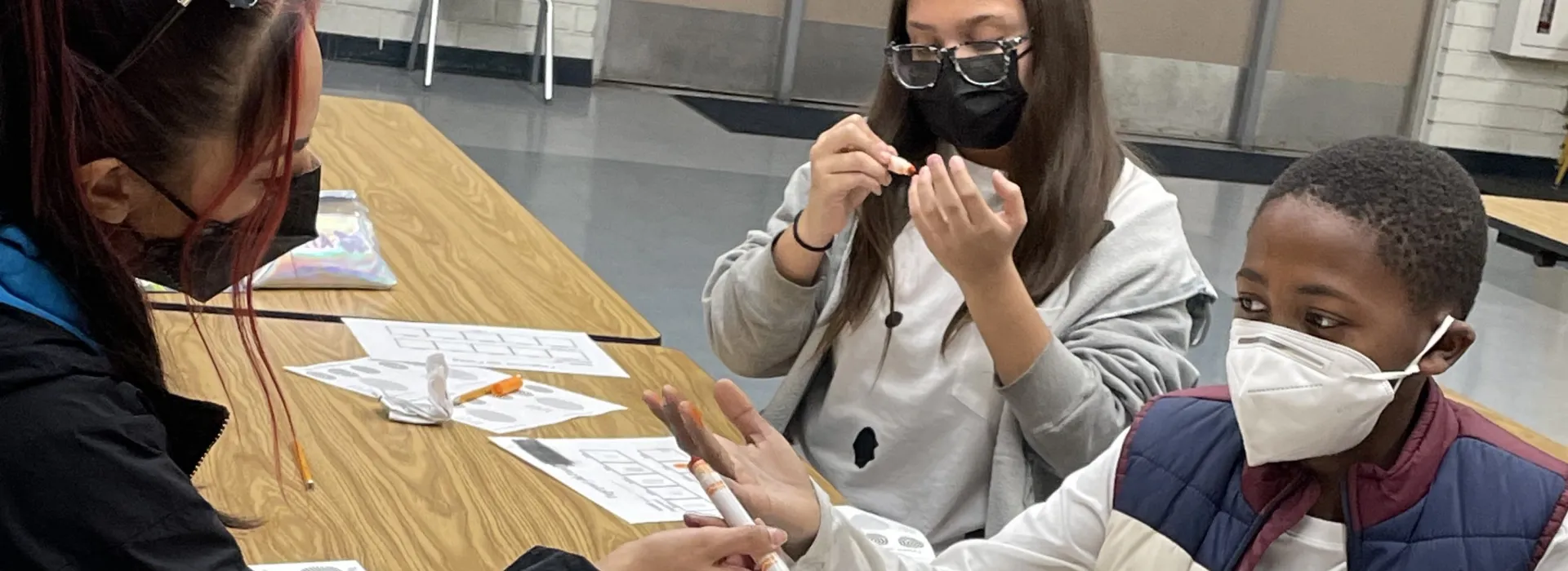 Palms students working with a staff