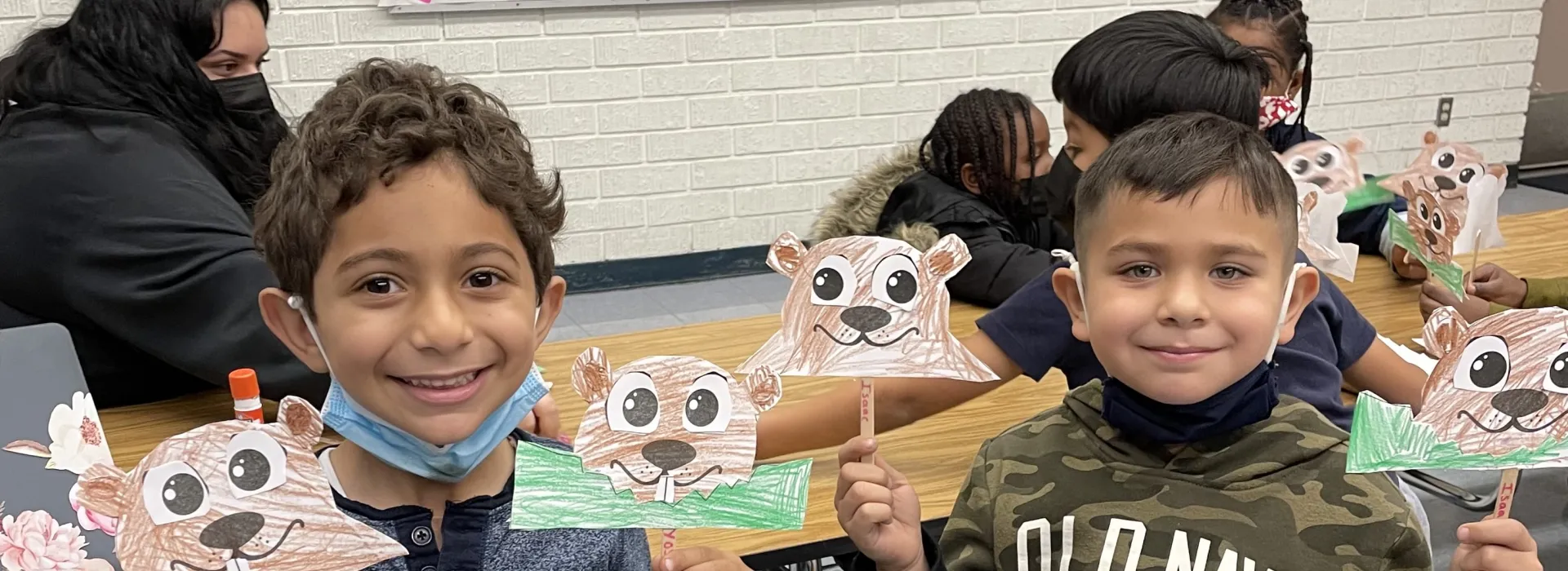 Palms students showing their groundhog crafts