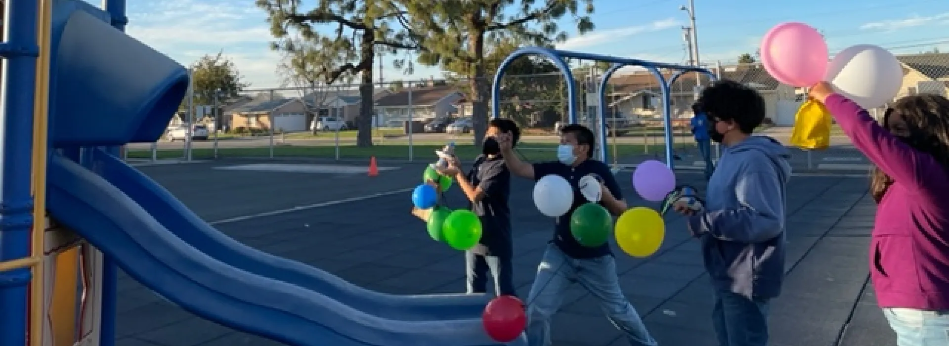 Melbourne students playing on the slide